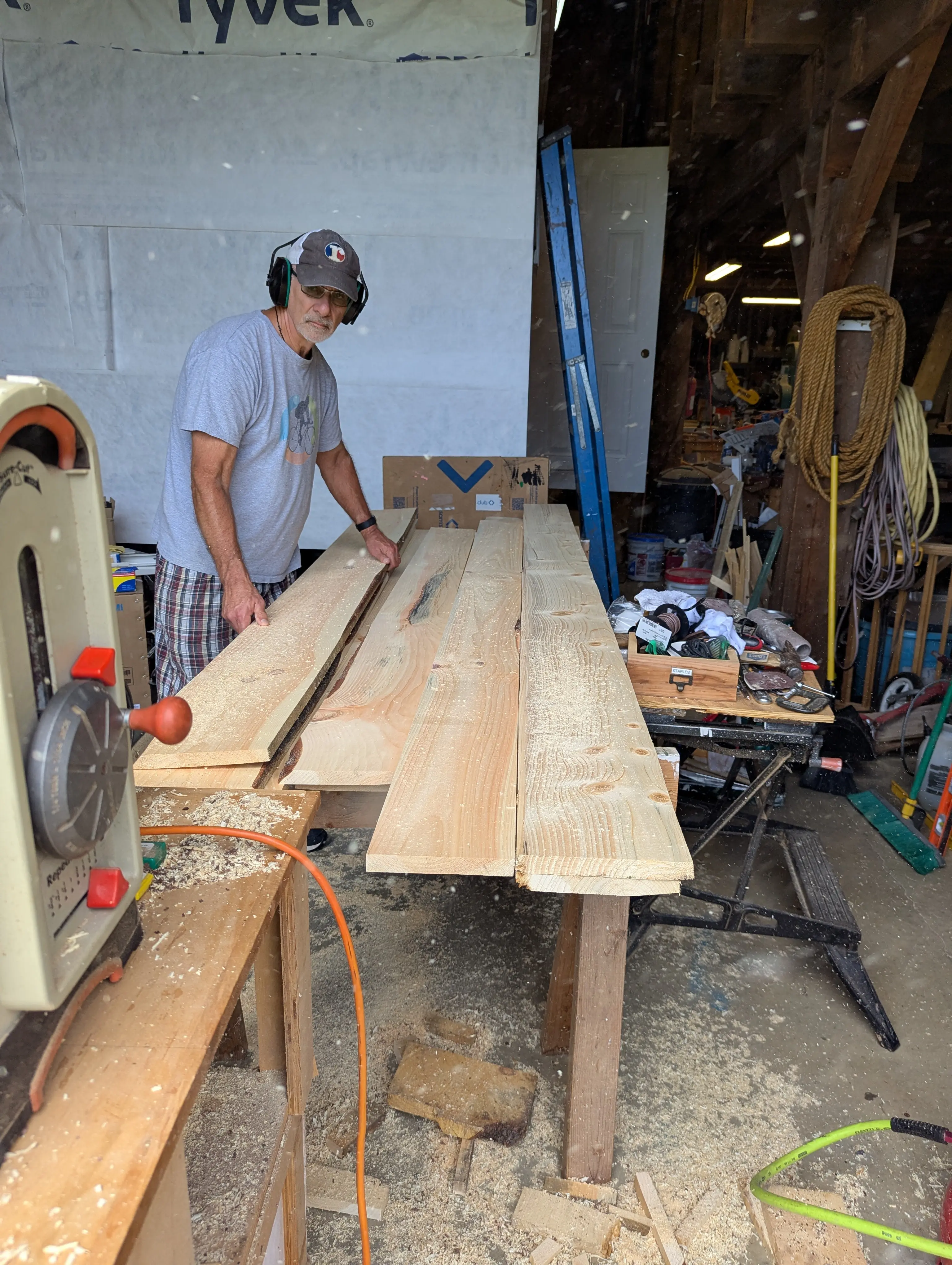 Planing wide plank pine boards down to consistent thickness for the Swig Rig floor