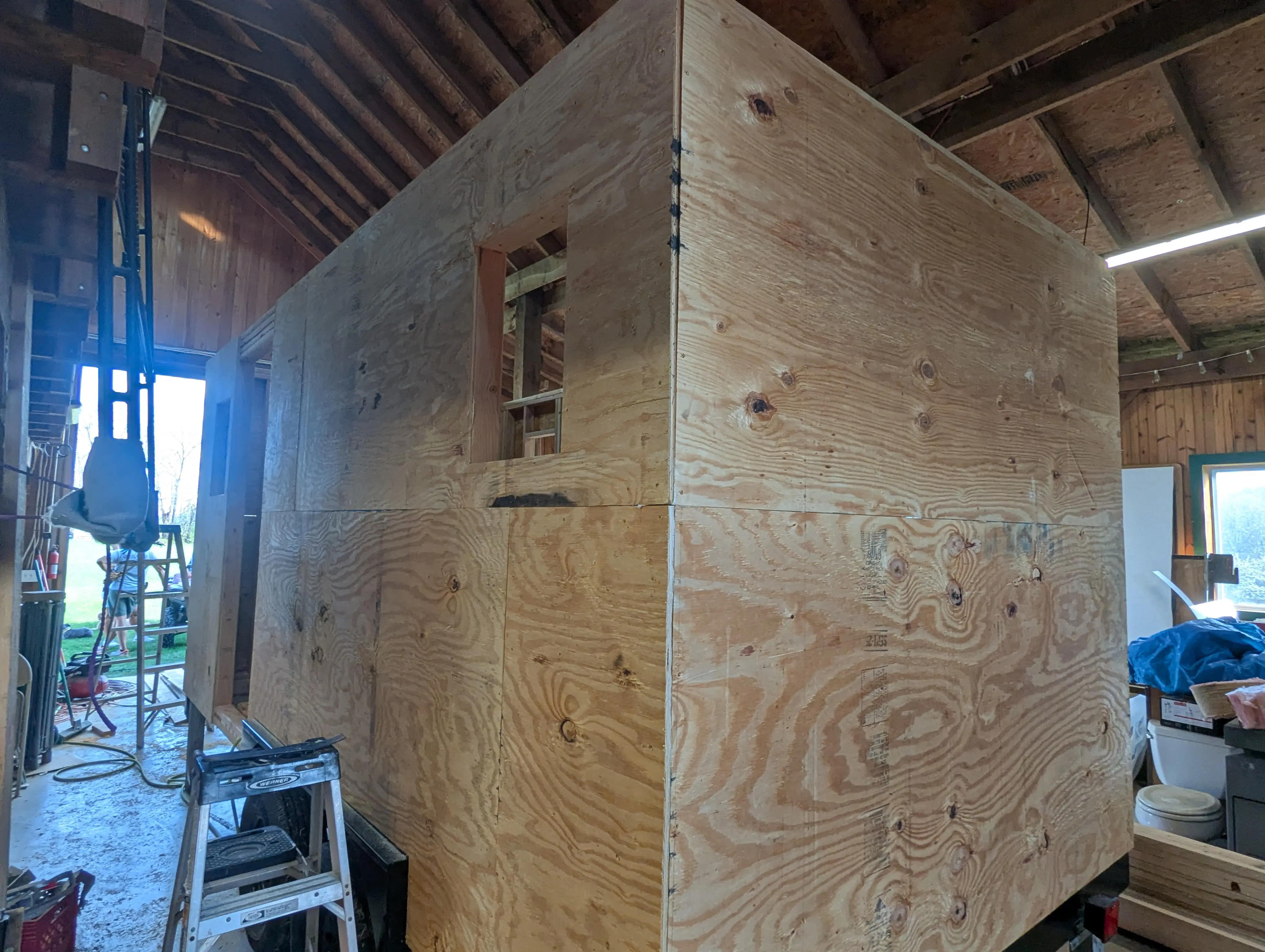 Aerial view of sheathing going on over the wall framing