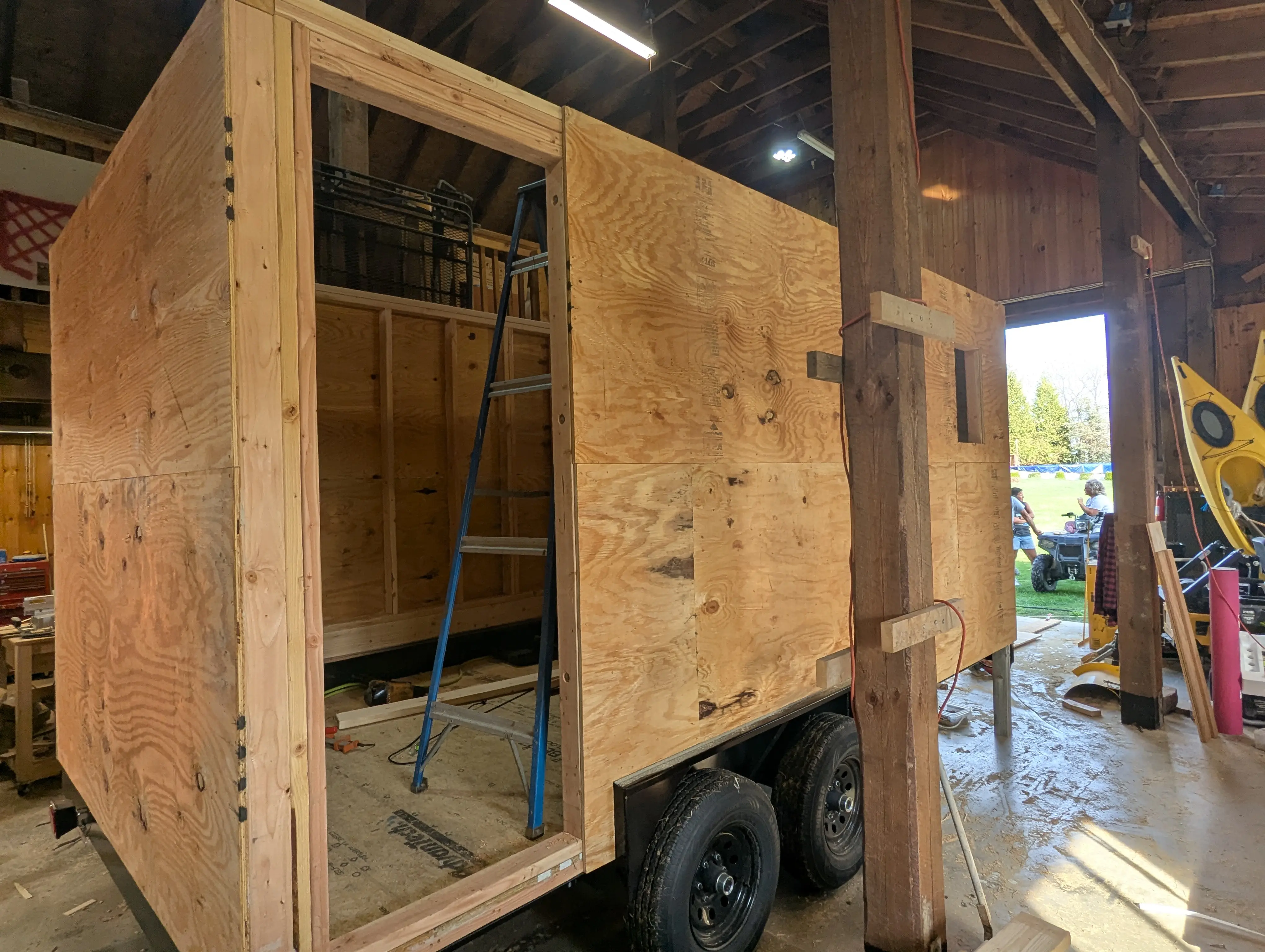 Exterior sheathed with plywood, door rough opening visible