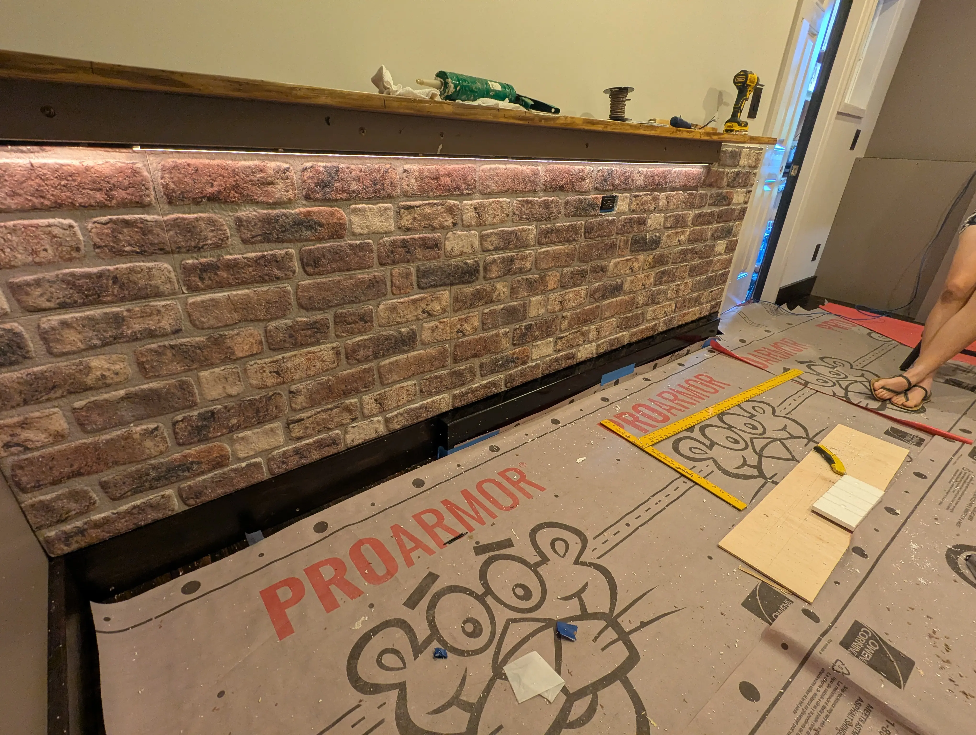 Faux brick installed on the driver side of the Swig Rig