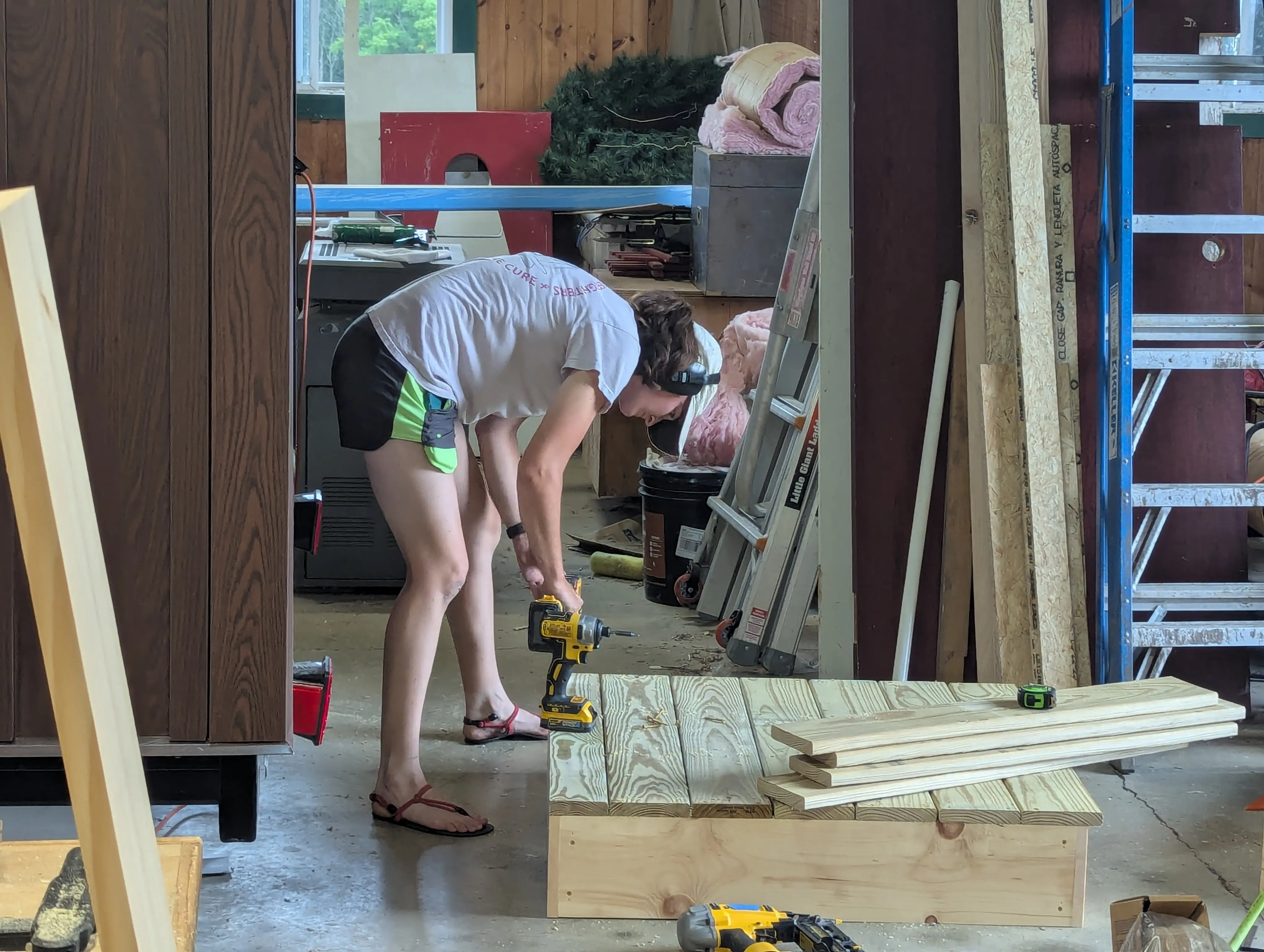 Olivia building the entry steps for the Swig Rig